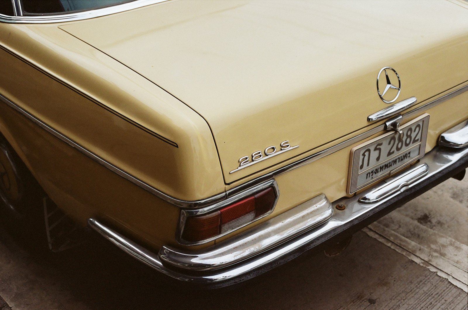 Vintage cream Mercedes-Benz 280S rear detail with Thai license plate, Pattaya, Thailand