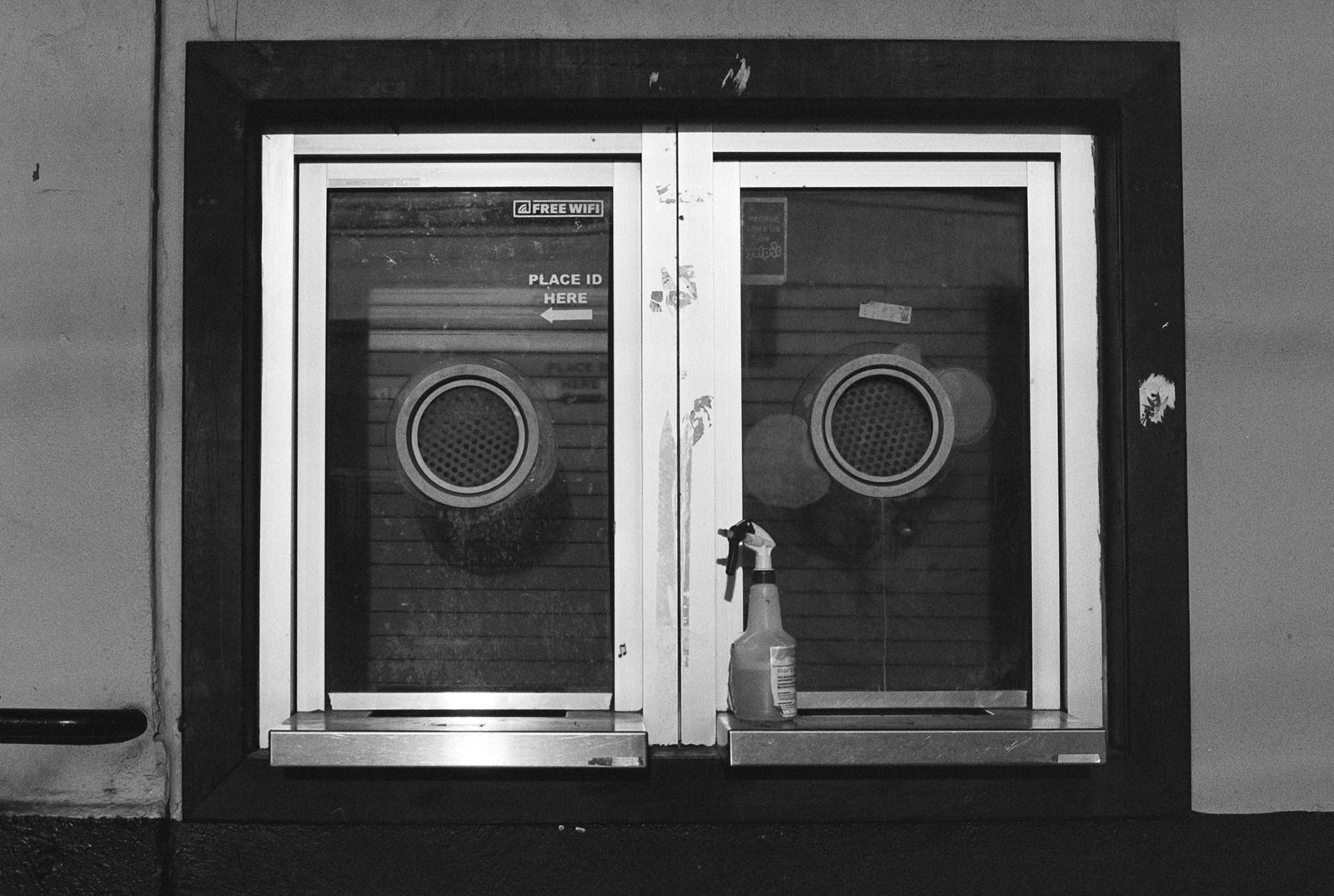 Closed ticket booth window with 'Place ID Here' sign at the former Warehouse Live venue, Houston, Texas